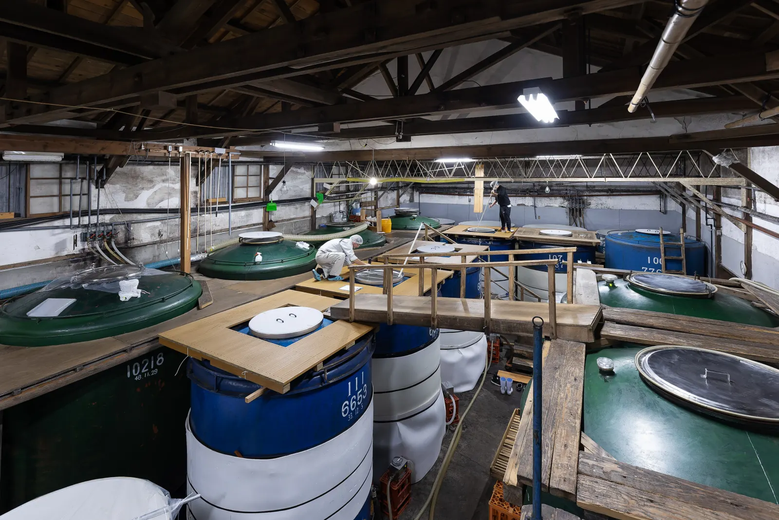 Fermentation tanks inside a working sake brewery