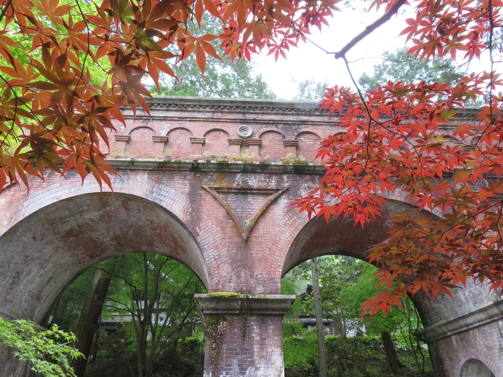 The brick aqueduct at Nanzen-ji under red maples