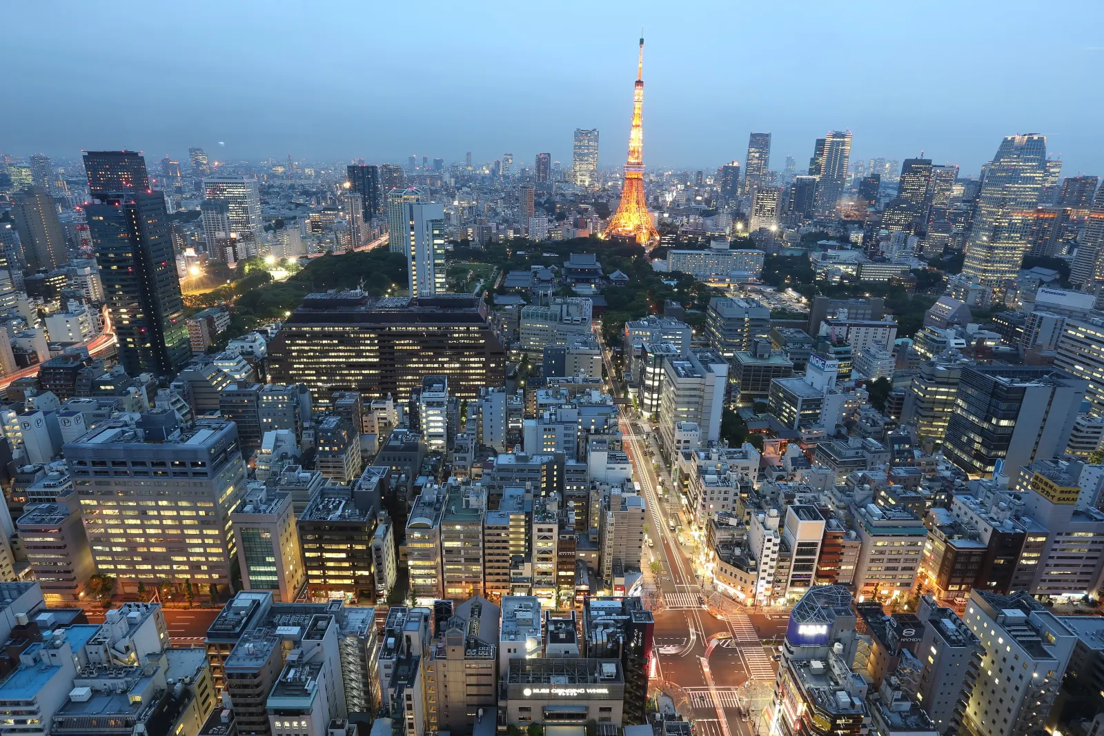 Tokyo Tower lit up at dusk, seen from above