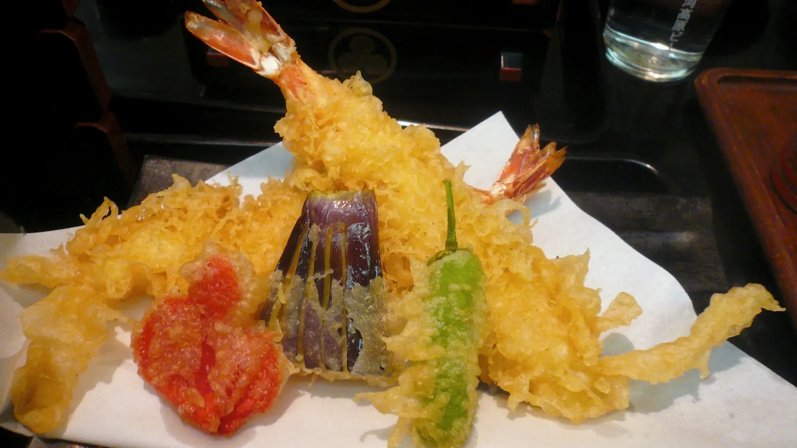 Prawn, aubergine and green pepper tempura on paper