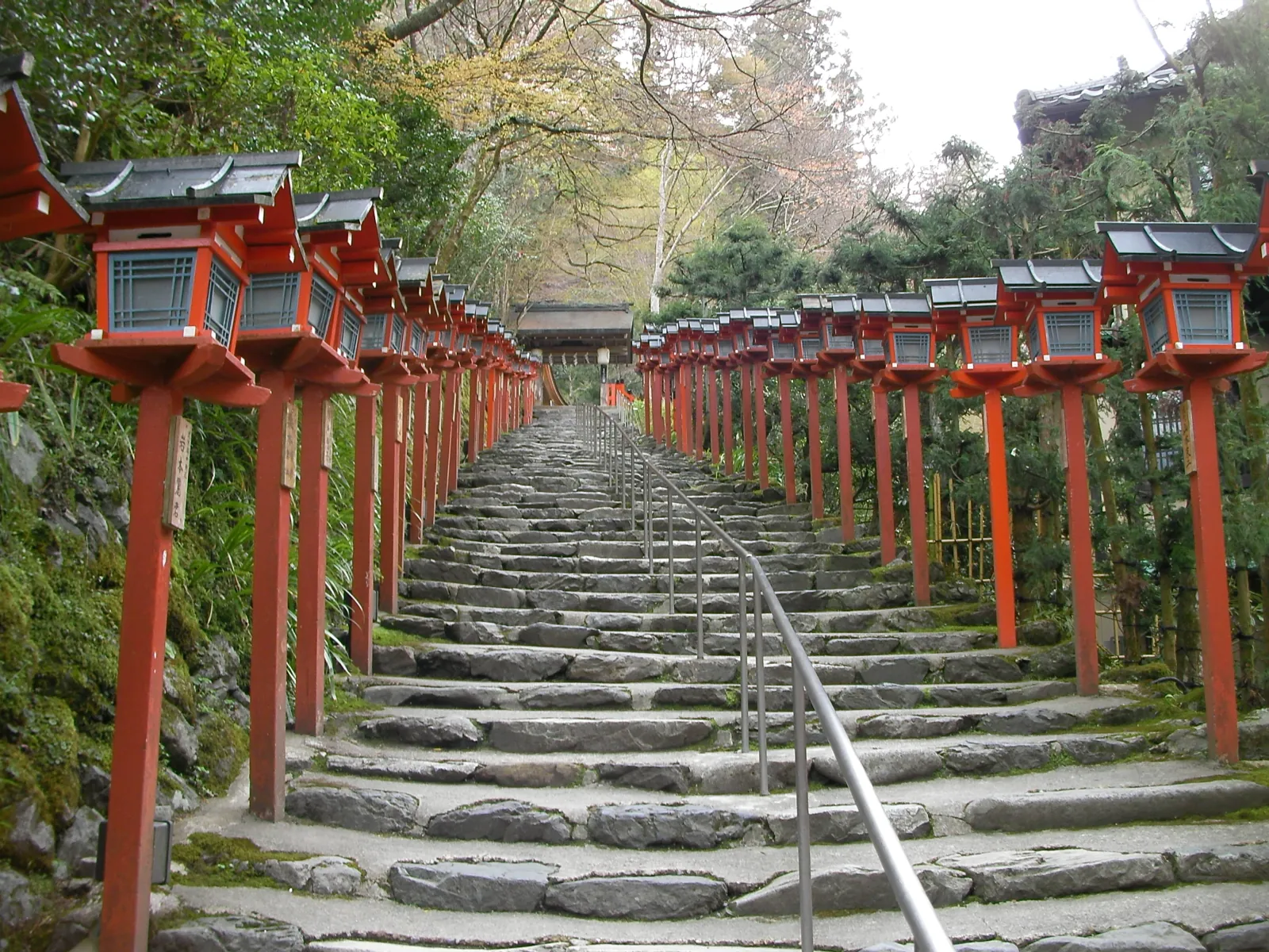 Red lanterns along a stone stair in the hills
