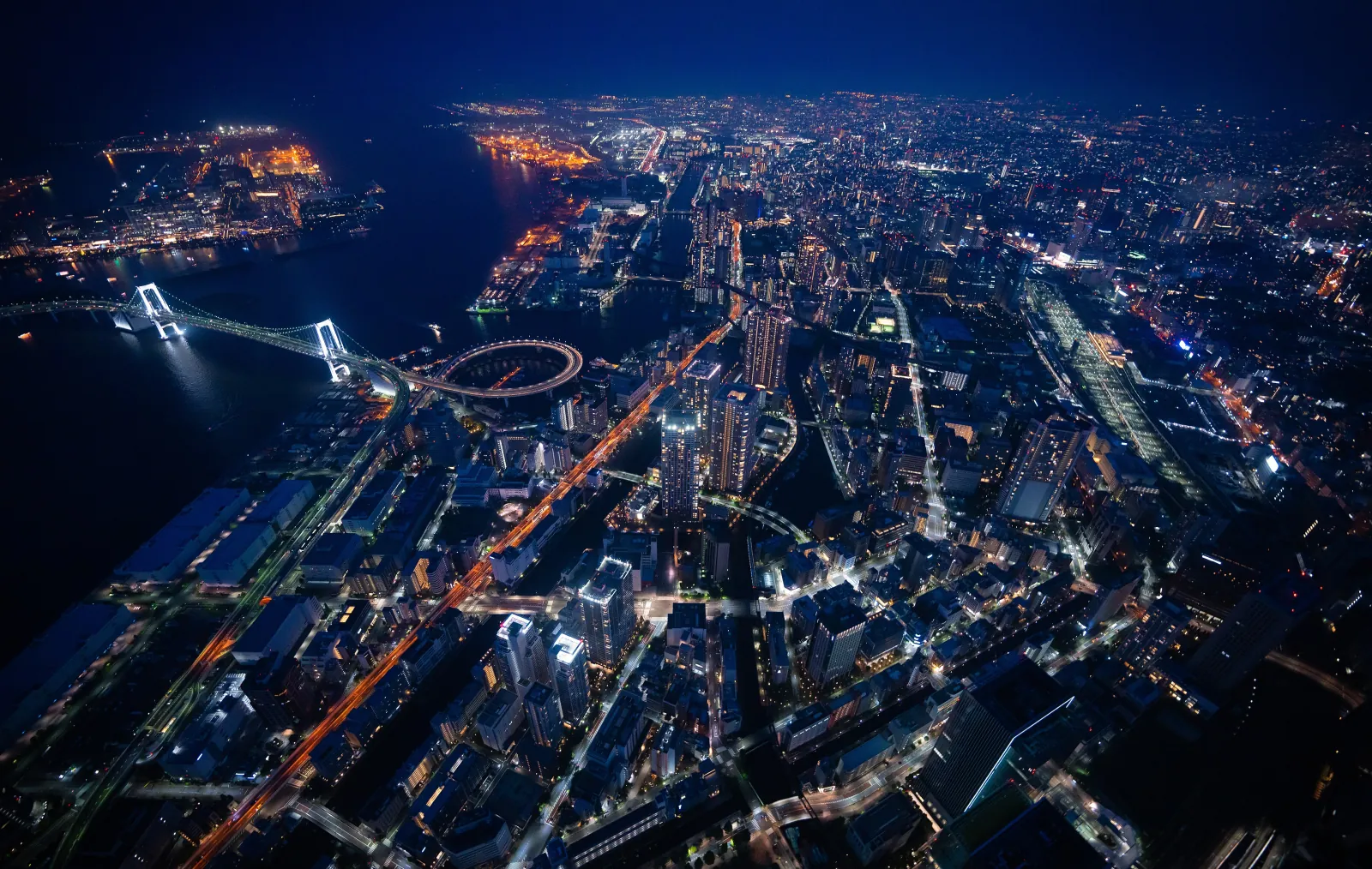 Rainbow Bridge and the bay at blue hour, from above