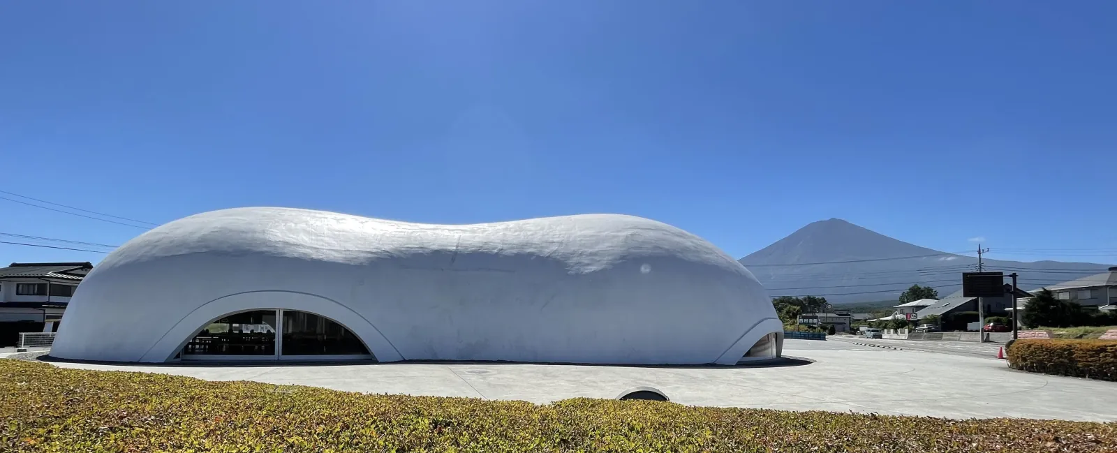 The cloud-shaped building with Fuji on the skyline