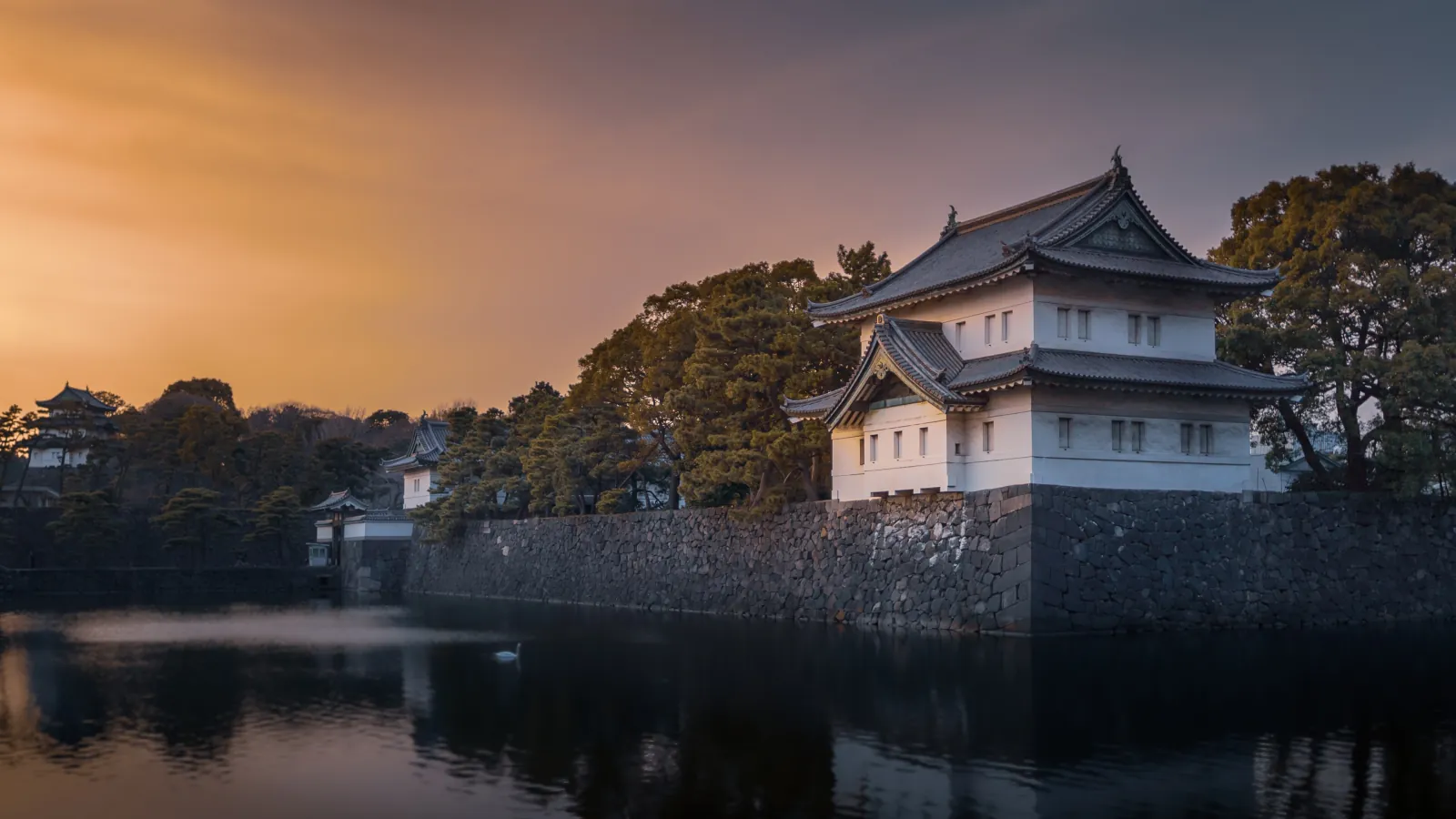 Tatsumi-yagura over the moat at sunset, near the tour's starting gate