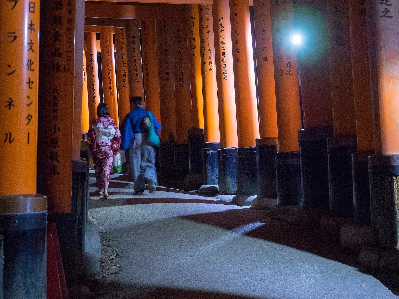 Walking down through the gates after dark
