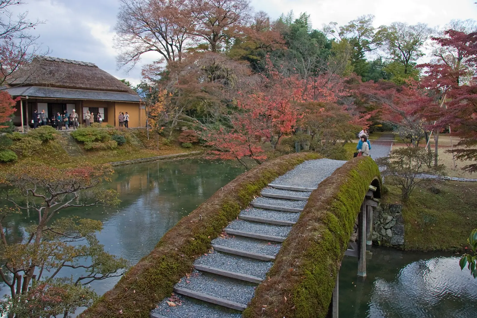 A moss-edged stone bridge toward a Katsura tea house
