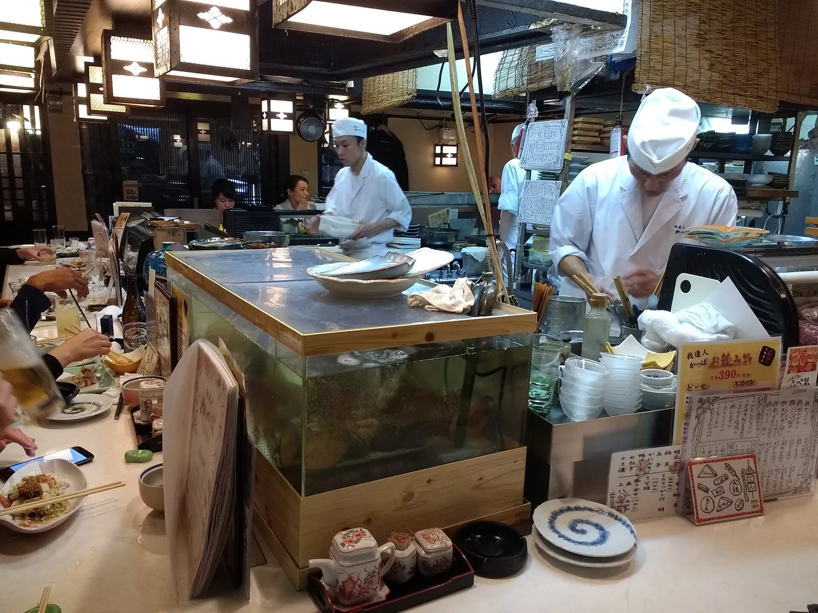 Cooks at work behind a Kyoto counter